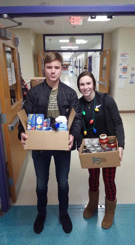 Loading up Passages Holiday Food Drive collection