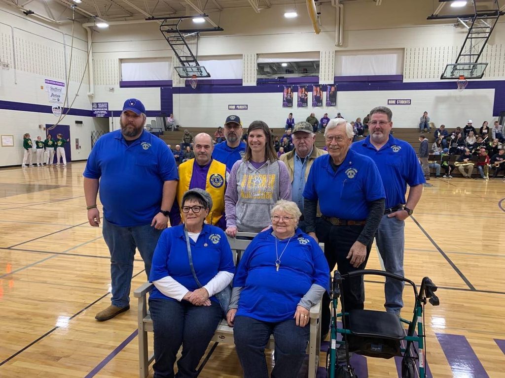 Ithaca Lions donate bench to school co-sponsored by Ithaca Volleyball Boosters